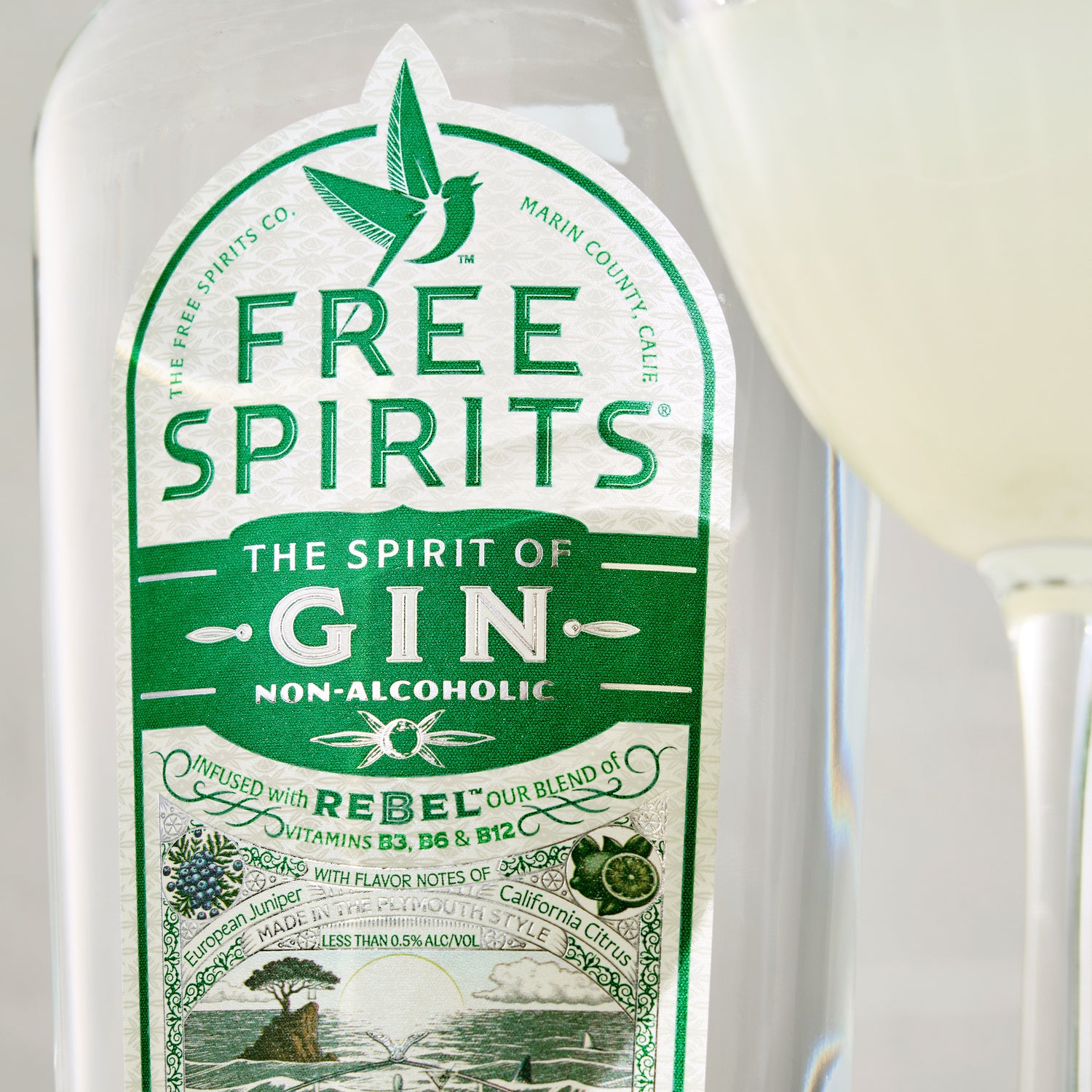 Non-alcoholic gin bottle with green label featuring 'Free Spirits' branding.
