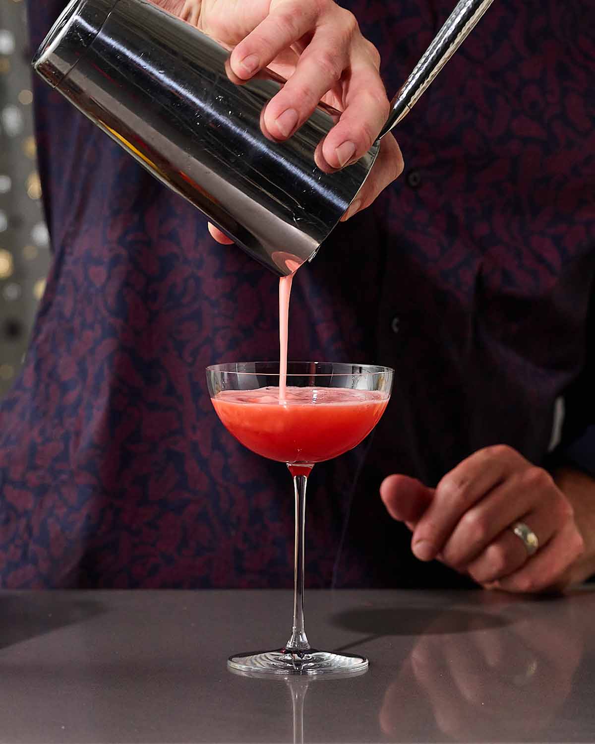 A bartender making an aperitivo based cocktail