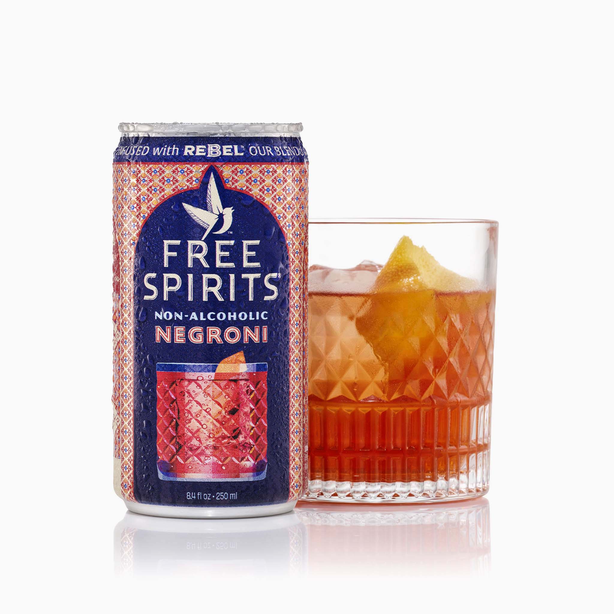 Free Spirits non-alcoholic Negroni can next to a poured Negroni cocktail