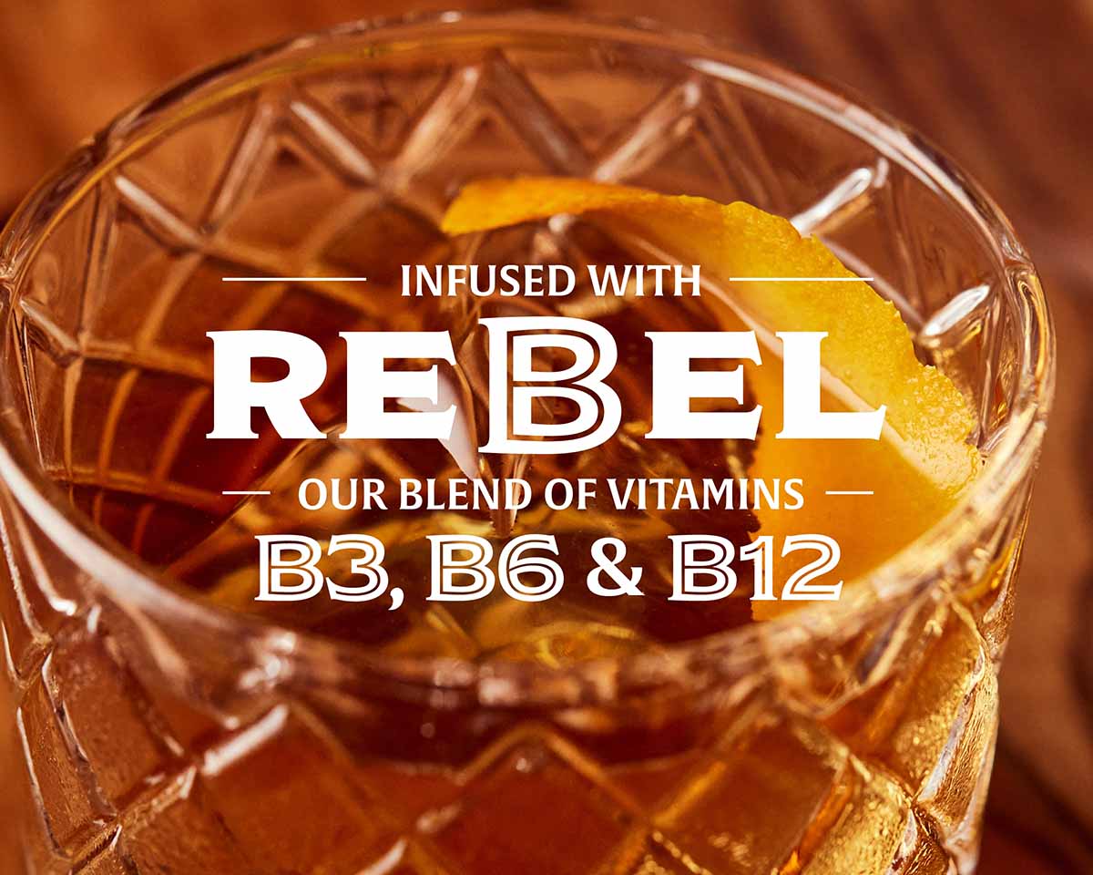 A non-alcoholic Old Fashioned and text about Rebel vitamins B3, B6, and B12.