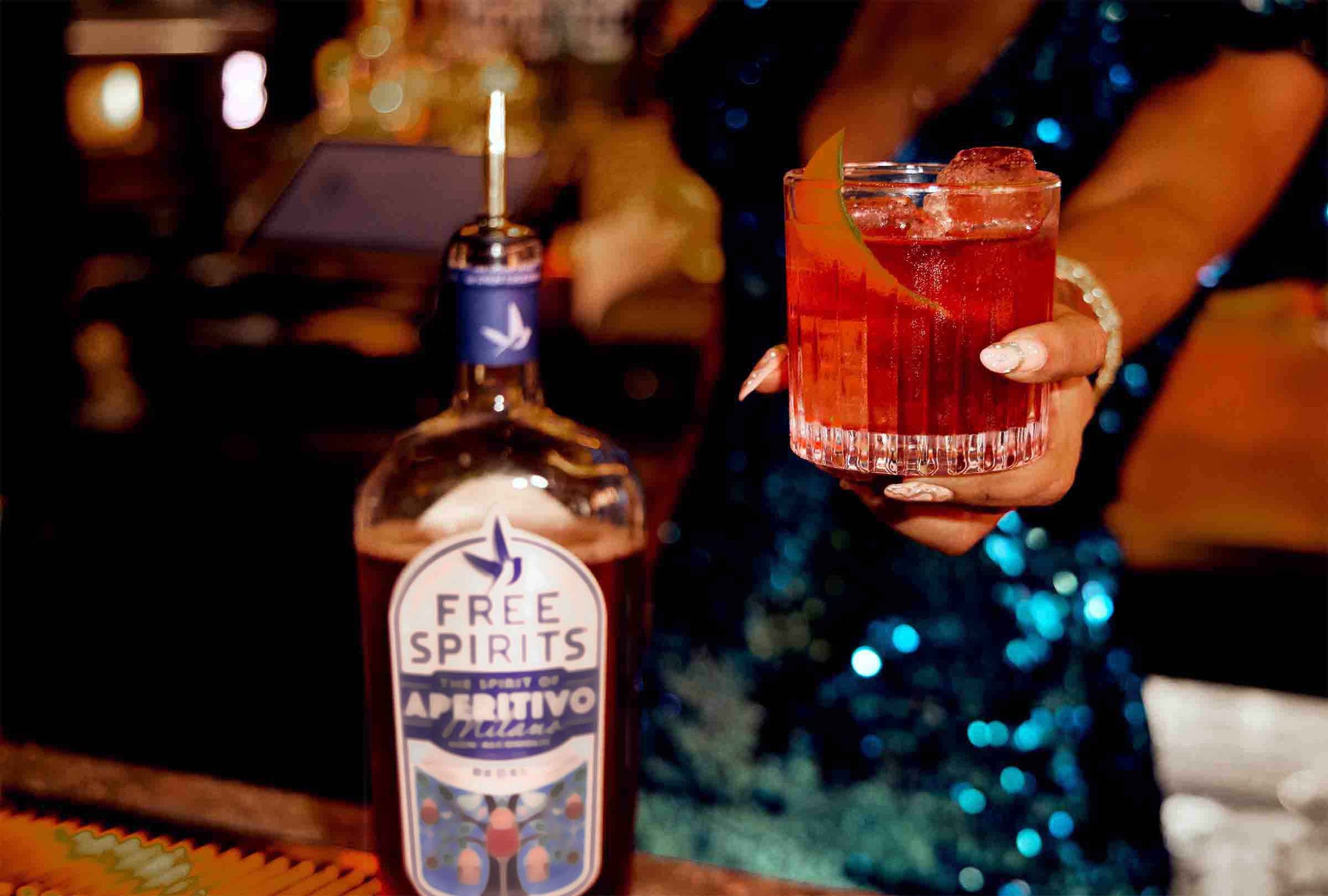 Bottle of Free Spirits with a cocktail in a bar setting