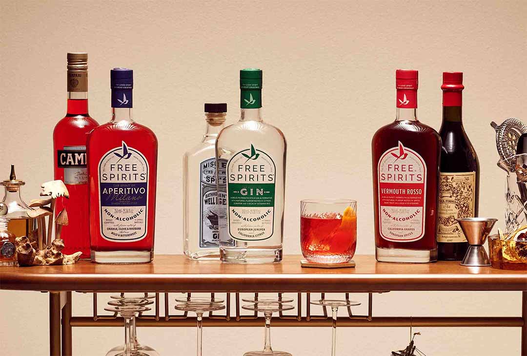 A bart op with Free Spirits in front of full-proof bottles