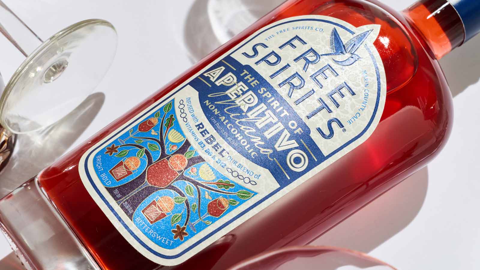 Bottle of Free Spirits Aperitivo with a colorful label on a white background