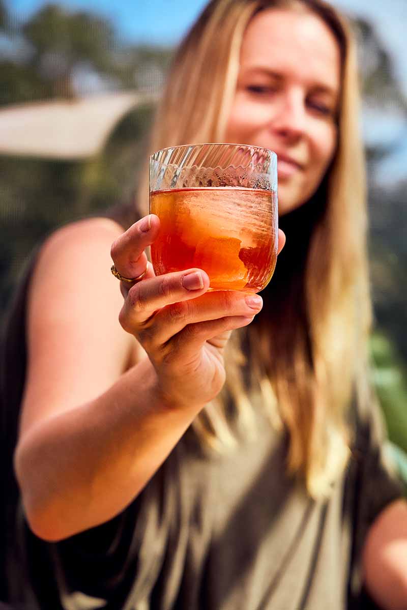 Sarah holding a Negroni