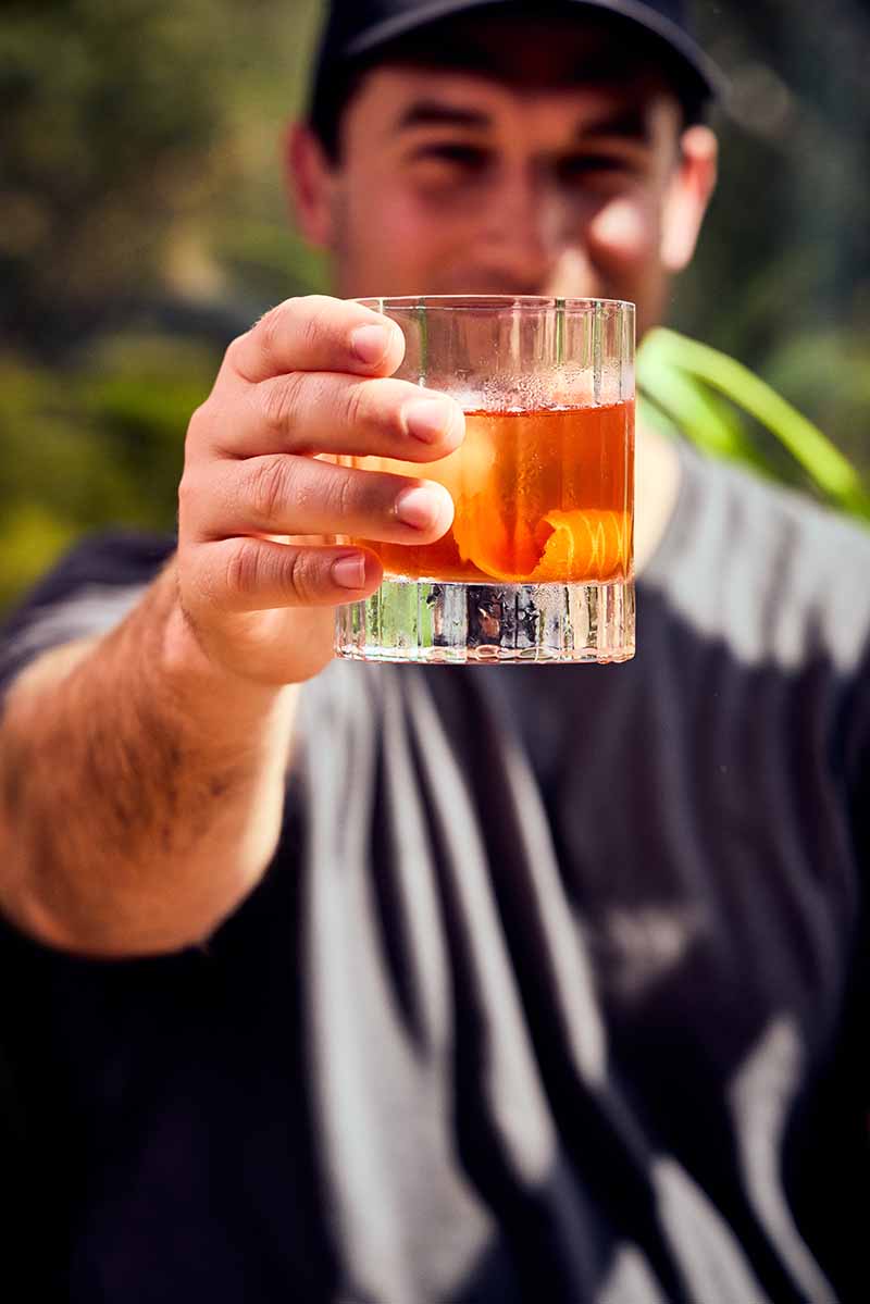 Spencer holding a Negroni
