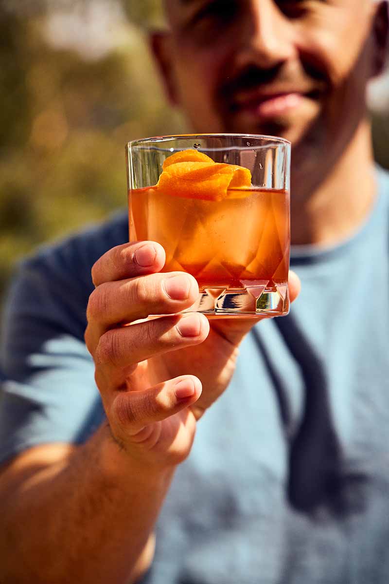 Jesse holding a Negroni
