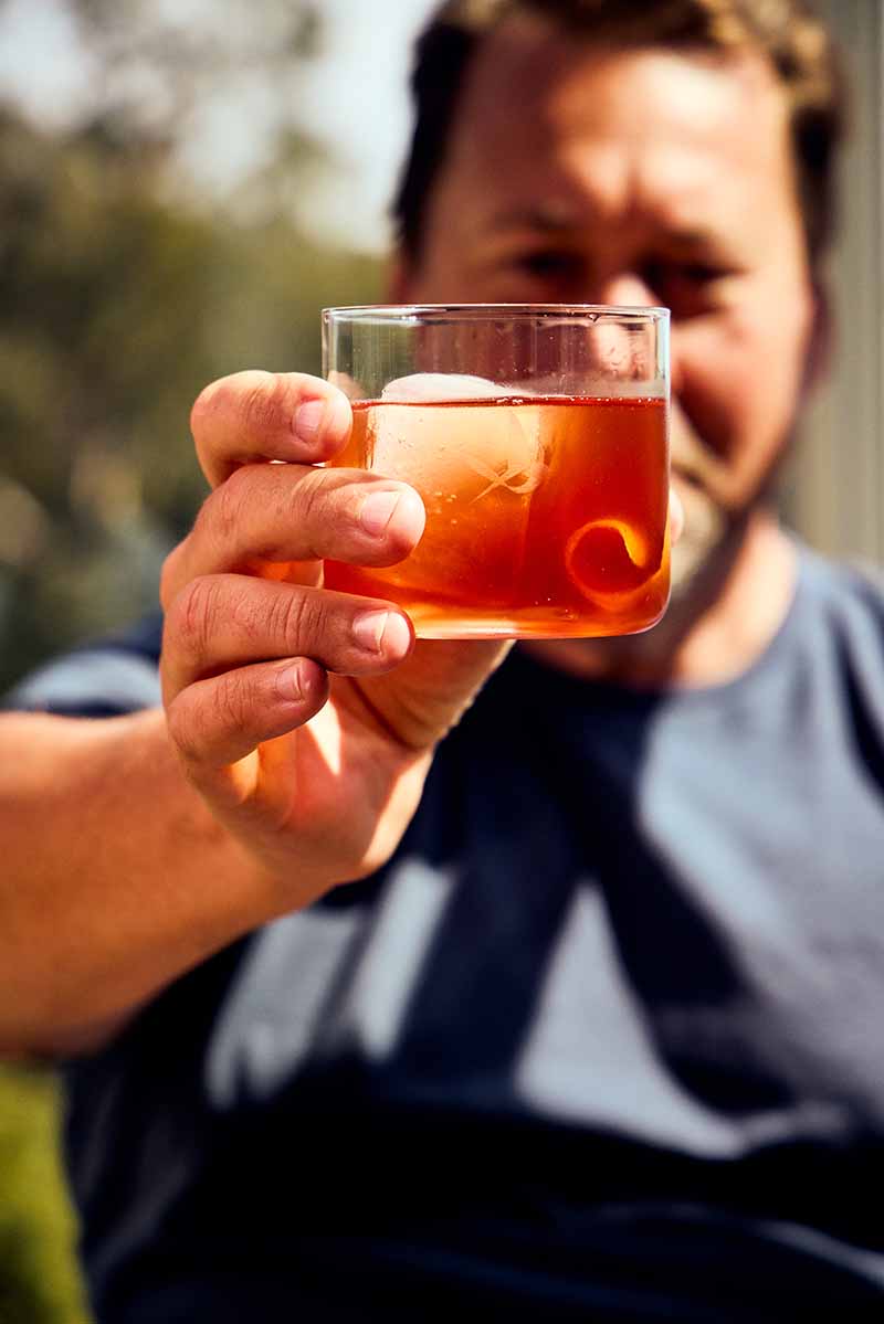 Milan holding a Negroni