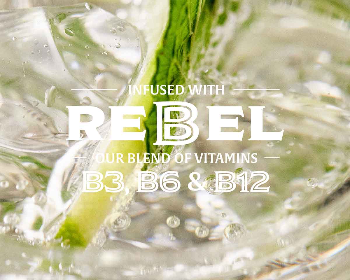 Non-alcoholic gin cocktail with a lemon slice and text about vitamins B3, B6, and B12 infused into the water.
