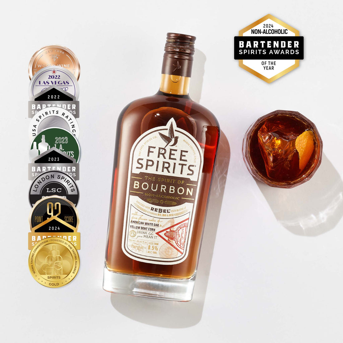 Bottle of Free Spirits Bourbon with awards on a white background